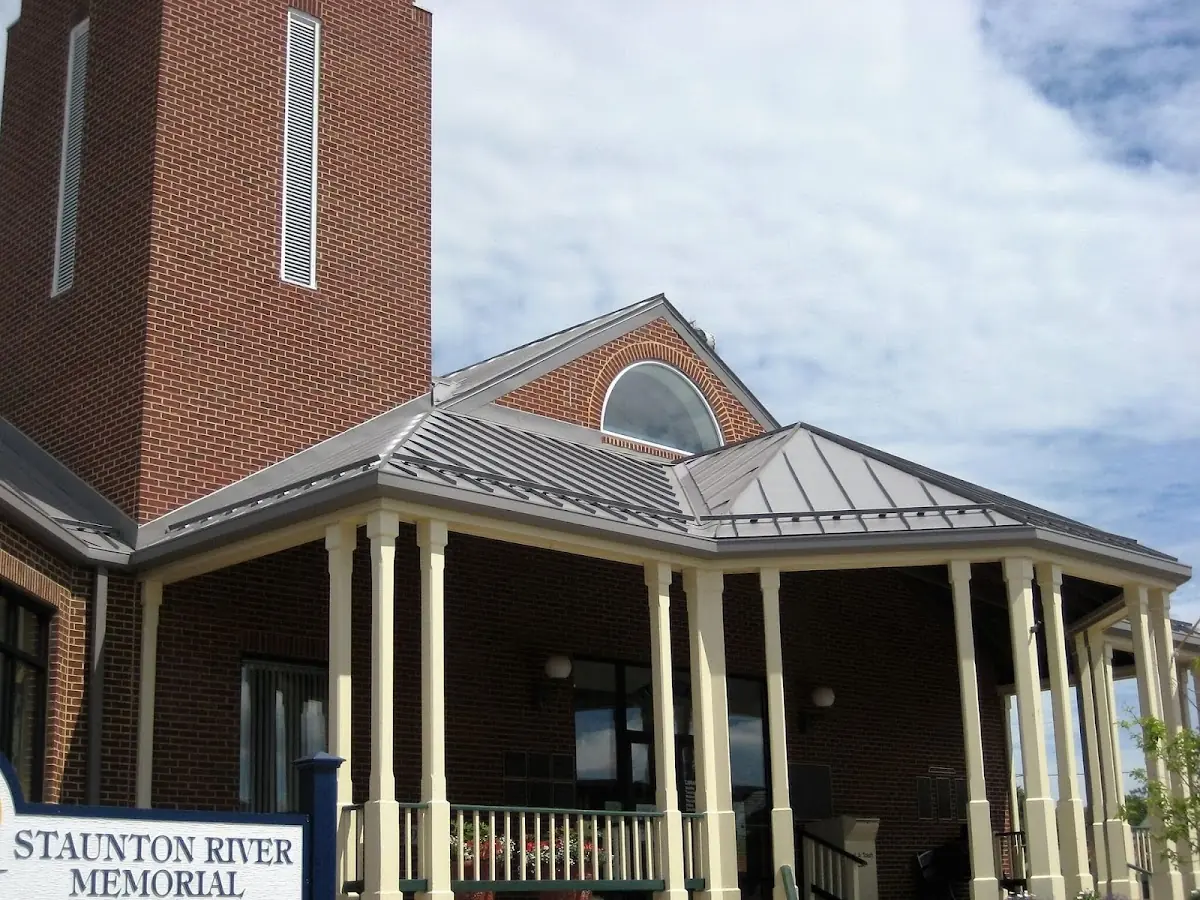 Skilled roofing craftsmen working on a residential roof in Baileyville